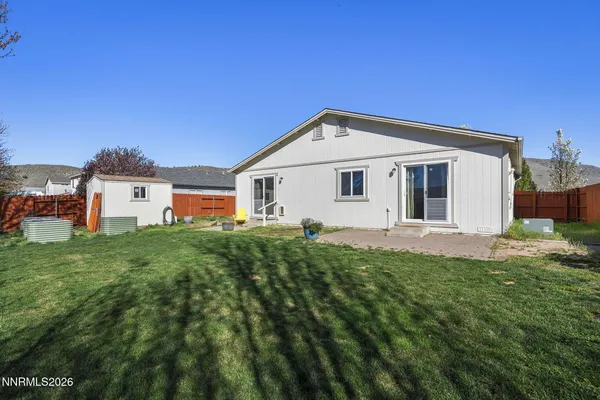 a view of backyard with seating space