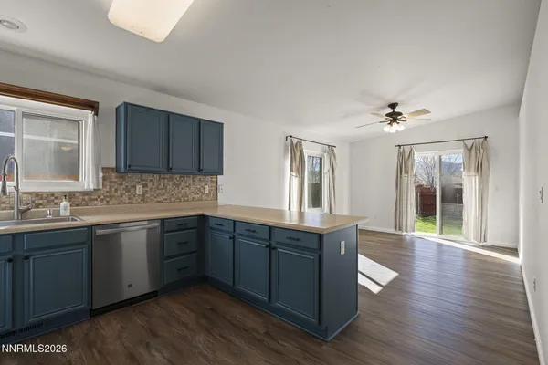 a spacious bathroom with a granite countertop sink and a mirror
