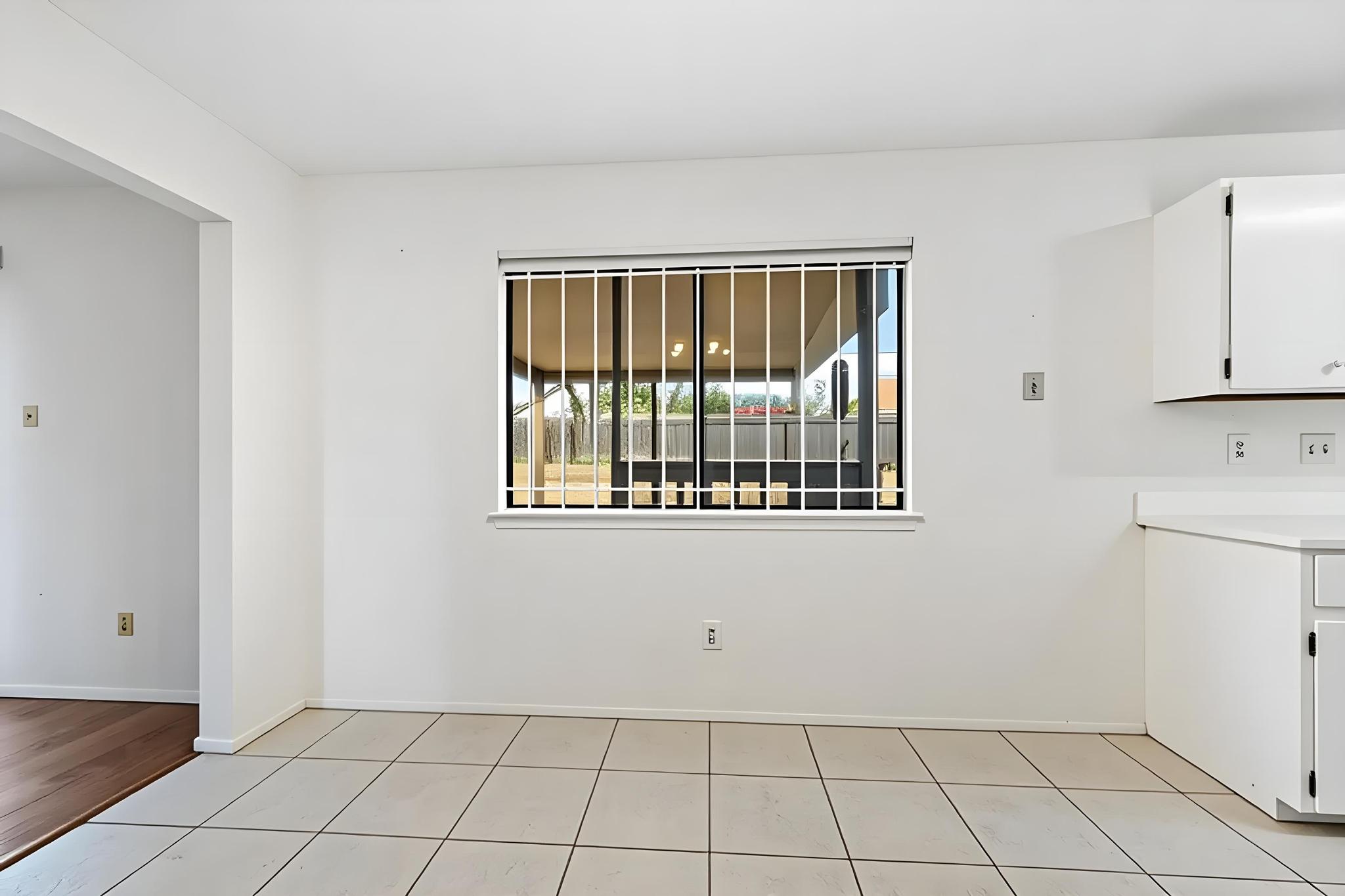11918 Snow Finch Road Austin, TX 78758 - Photo 11 of 33 Unfurnished dining area with baseboards