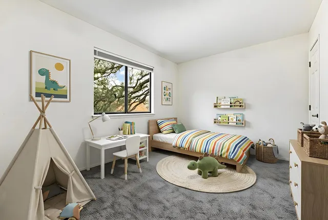 a living room with furniture and a window