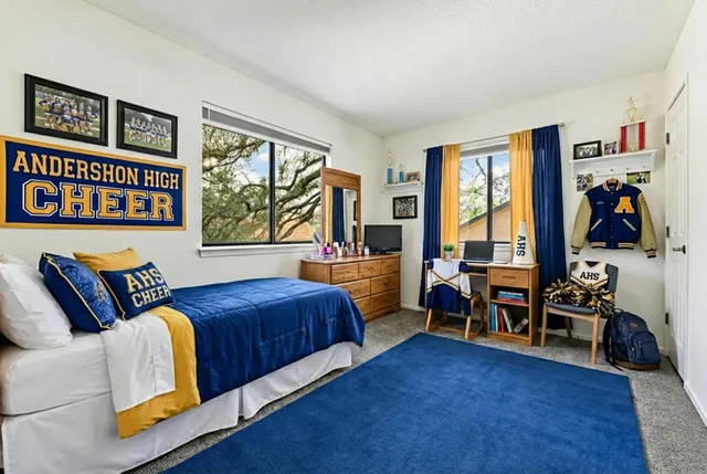 a bedroom with furniture and a window