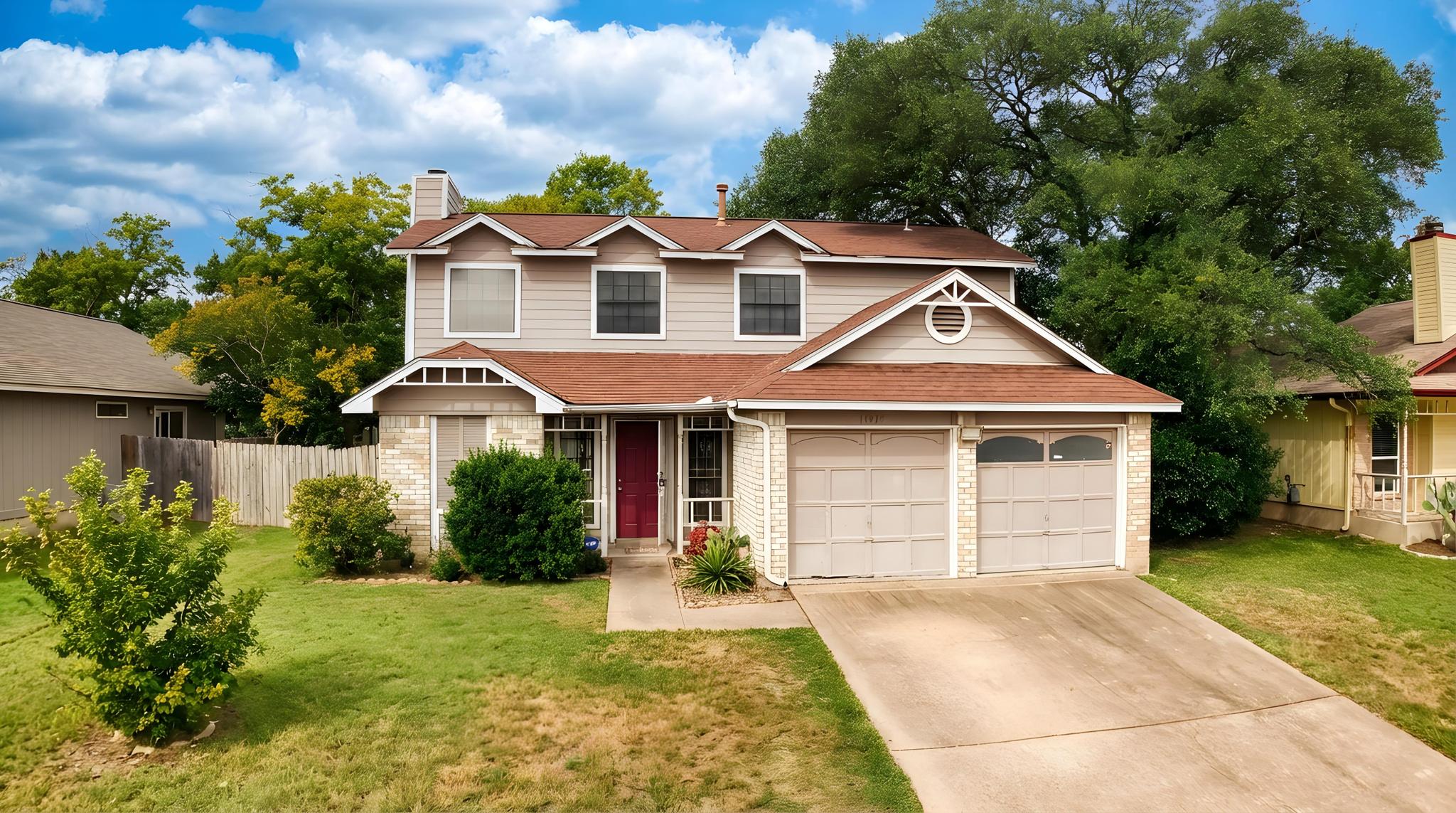 11918 Snow Finch Road Austin, TX 78758 - Photo 2 of 33 Traditional-style home featuring brick siding, concrete driveway, a chimney, and a garage