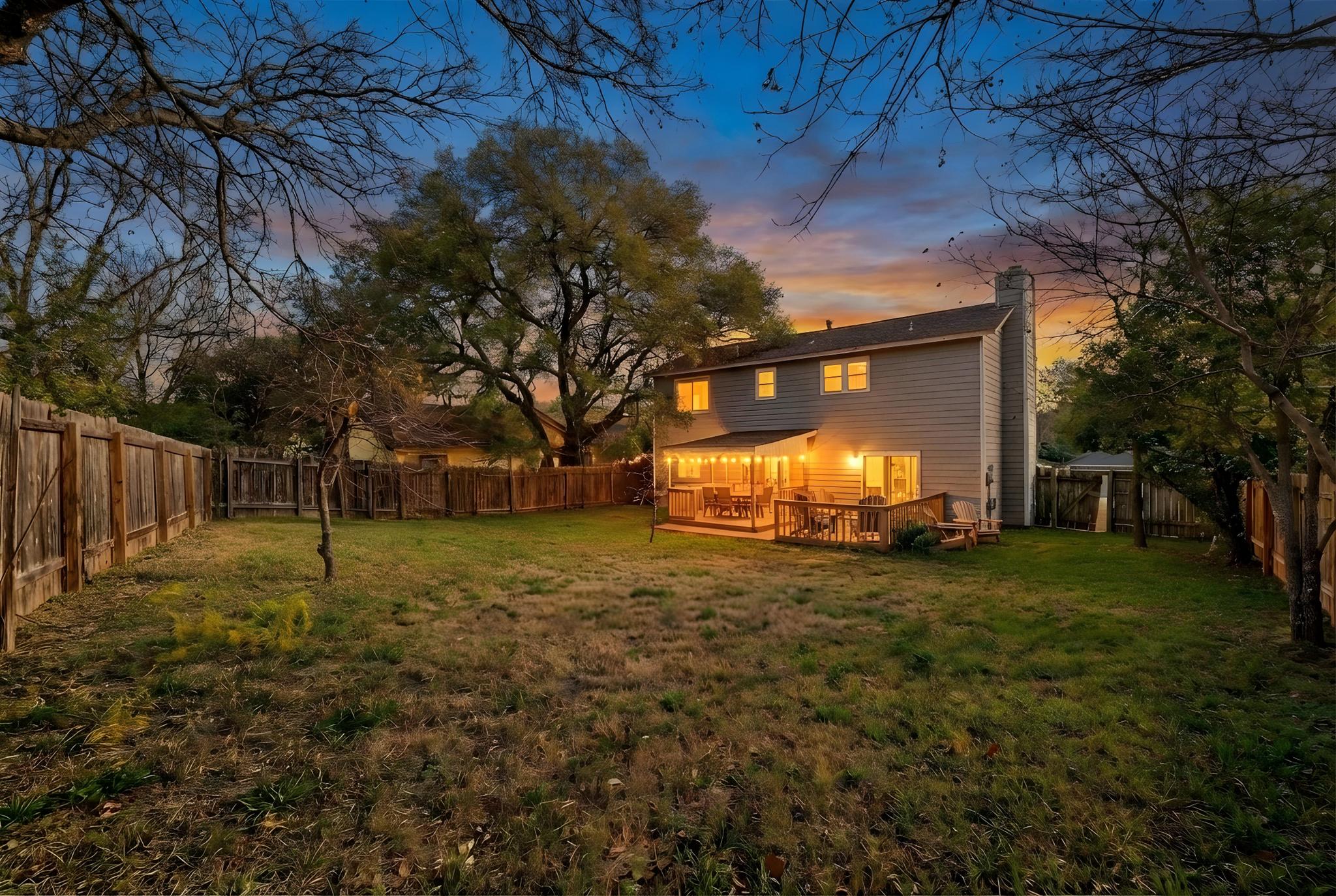 11918 Snow Finch Road Austin, TX 78758 - Photo 33 of 33 Rear view of house with a fenced backyard and a chimney