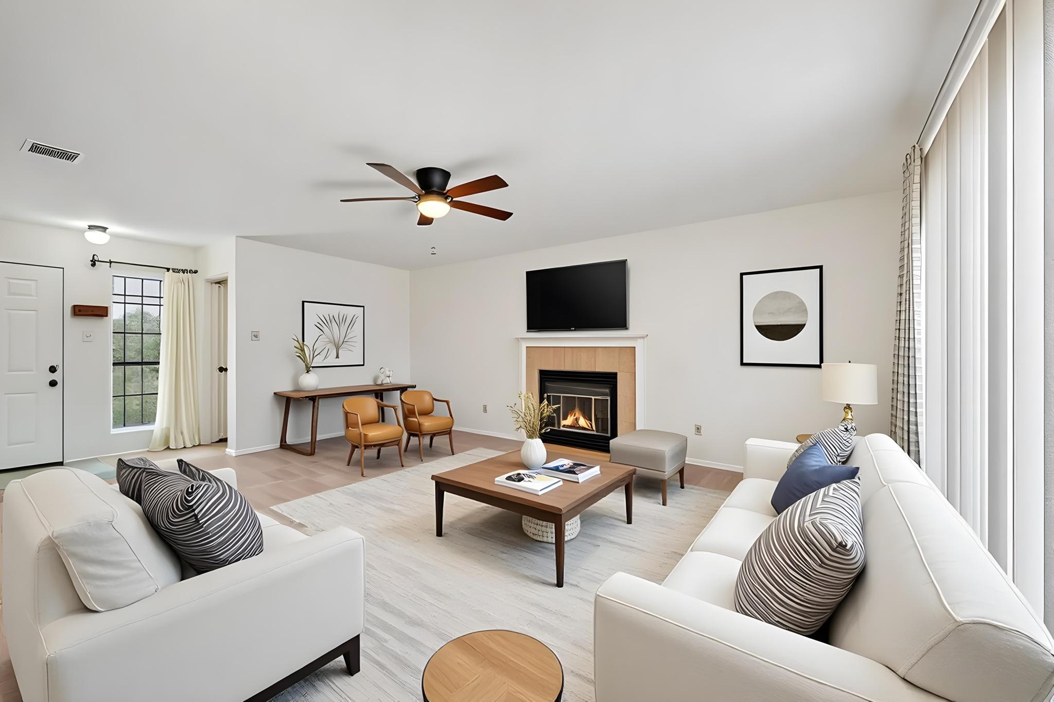 11918 Snow Finch Road Austin, TX 78758 - Photo 5 of 33 Living room with a tile fireplace, light wood finished floors, and a ceiling fan