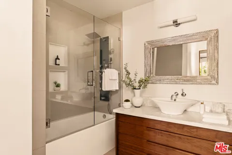 a bathroom with a bathtub and a sink
