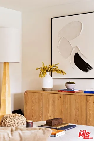 a bedroom with a bed and cabinets