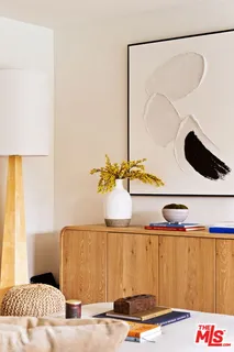 a bedroom with a bed and cabinets