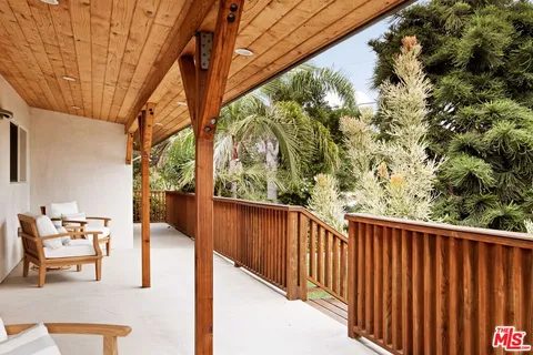 a view of balcony with furniture