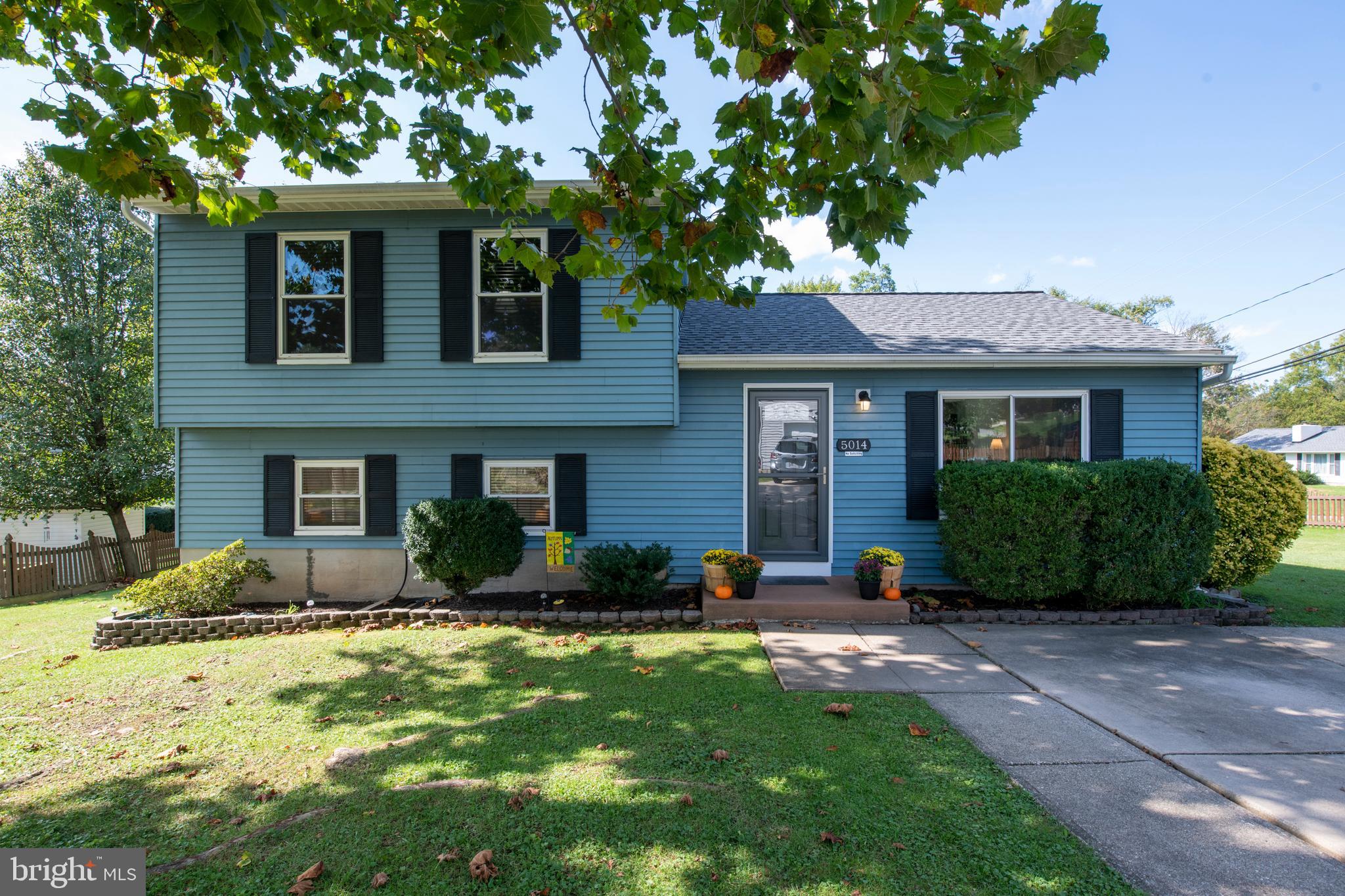 5014 Tartan Hill Road Perry Hall, MD 21128 - Photo 1 of 43 a front view of a house with a yard and garage