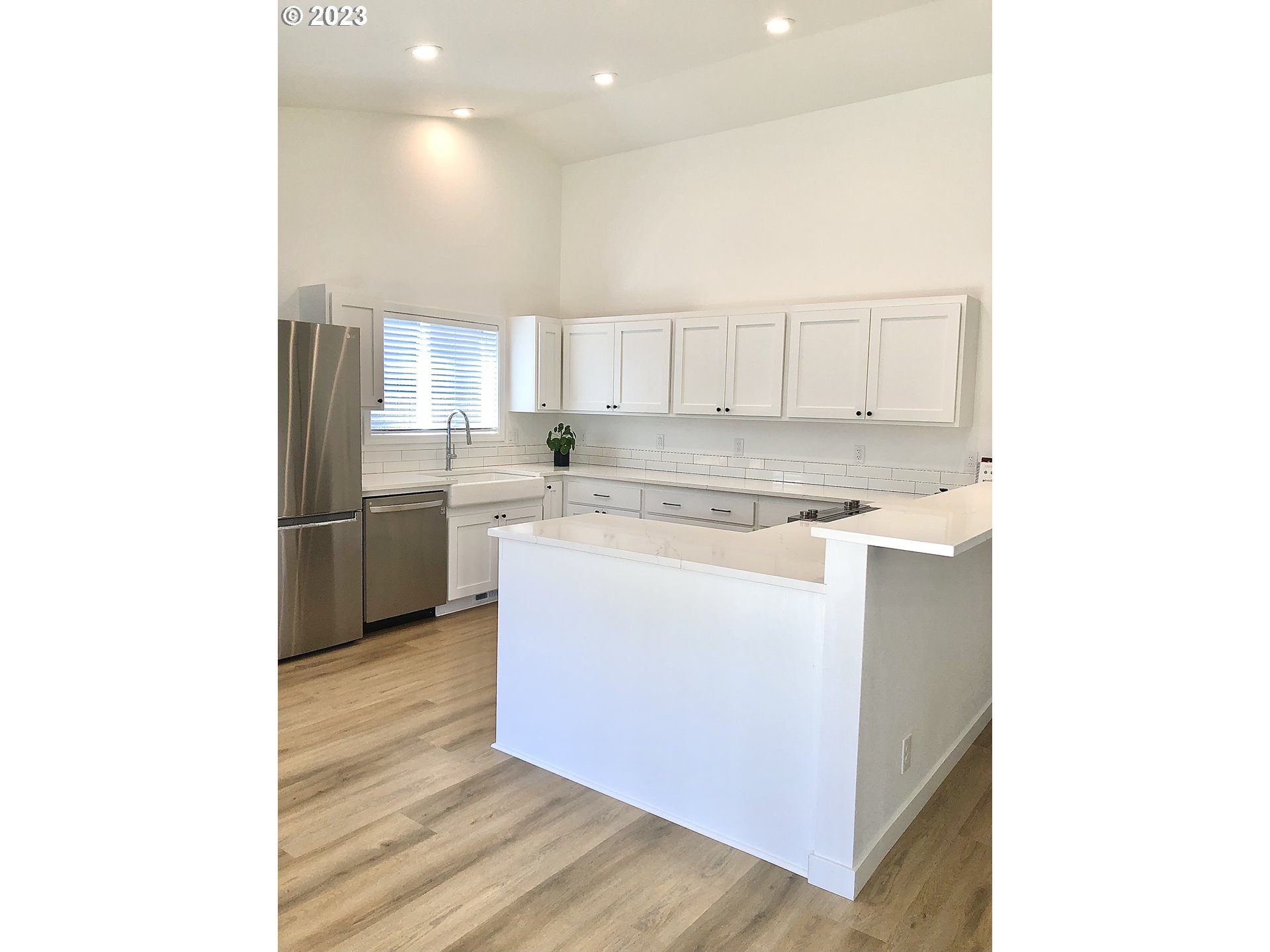 4961 Forsythia Street Springfield, OR 97478 - Photo 5 of 14 a kitchen with stainless steel appliances granite countertop a sink and a stove