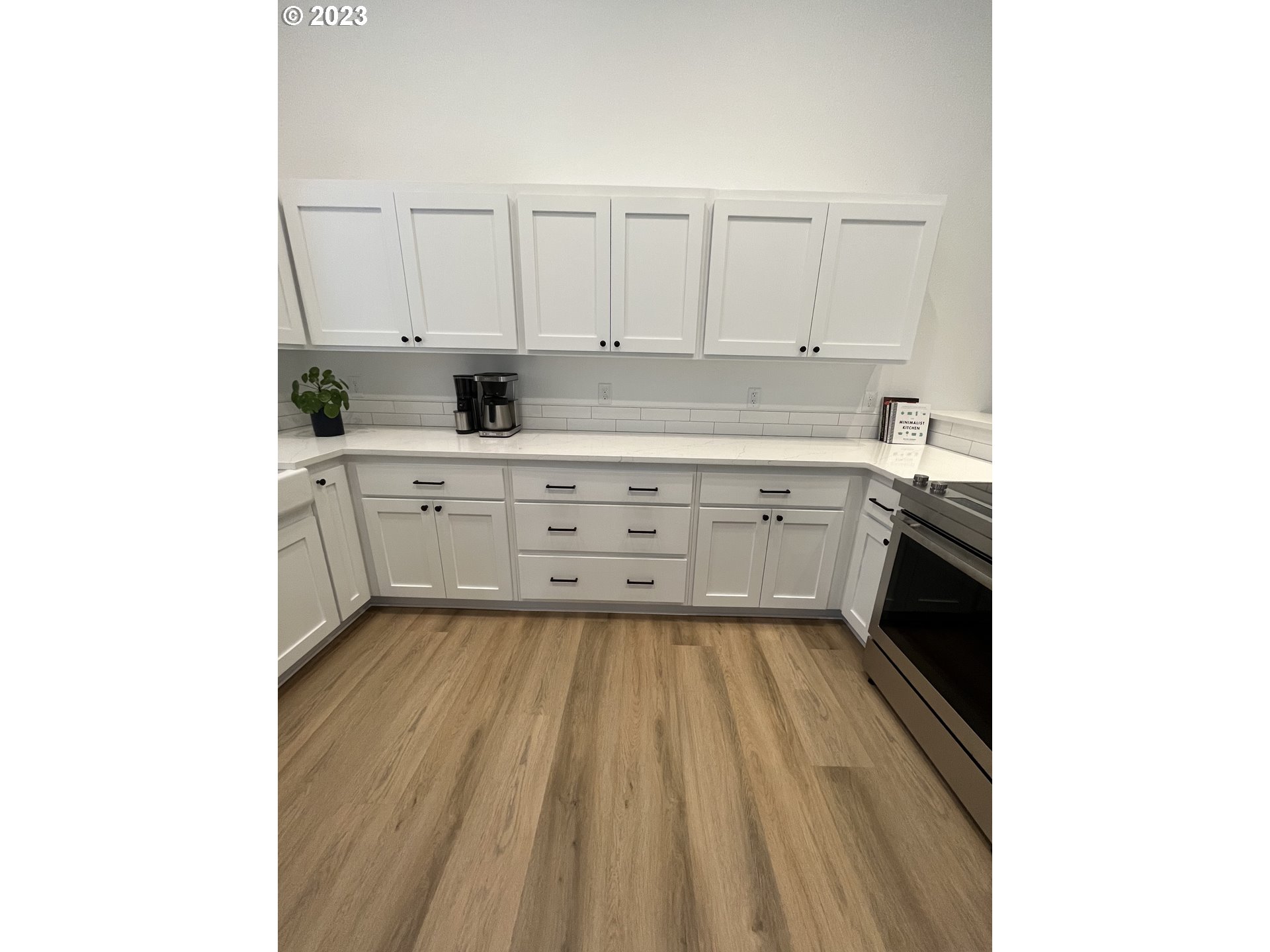 4961 Forsythia Street Springfield, OR 97478 - Photo 7 of 14 a kitchen with a sink and cabinets