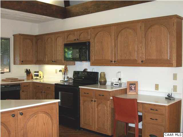 5462 Laurel Ridge Road Charlottesville, VA 22911 - Photo 42 of 50 a kitchen with a sink a stove and cabinets
