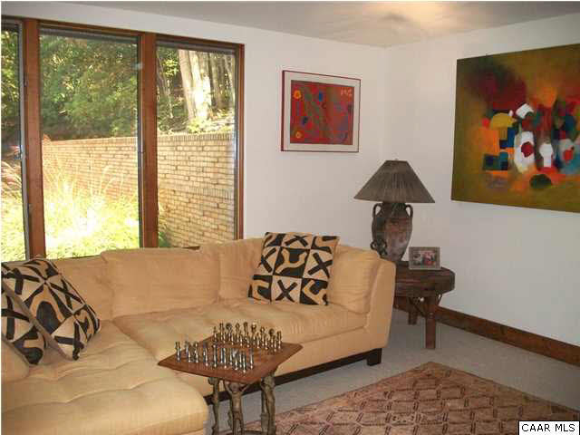 5462 Laurel Ridge Road Charlottesville, VA 22911 - Photo 46 of 50 a living room with furniture and a large window