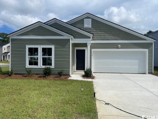 View of front of property with concrete driveway,