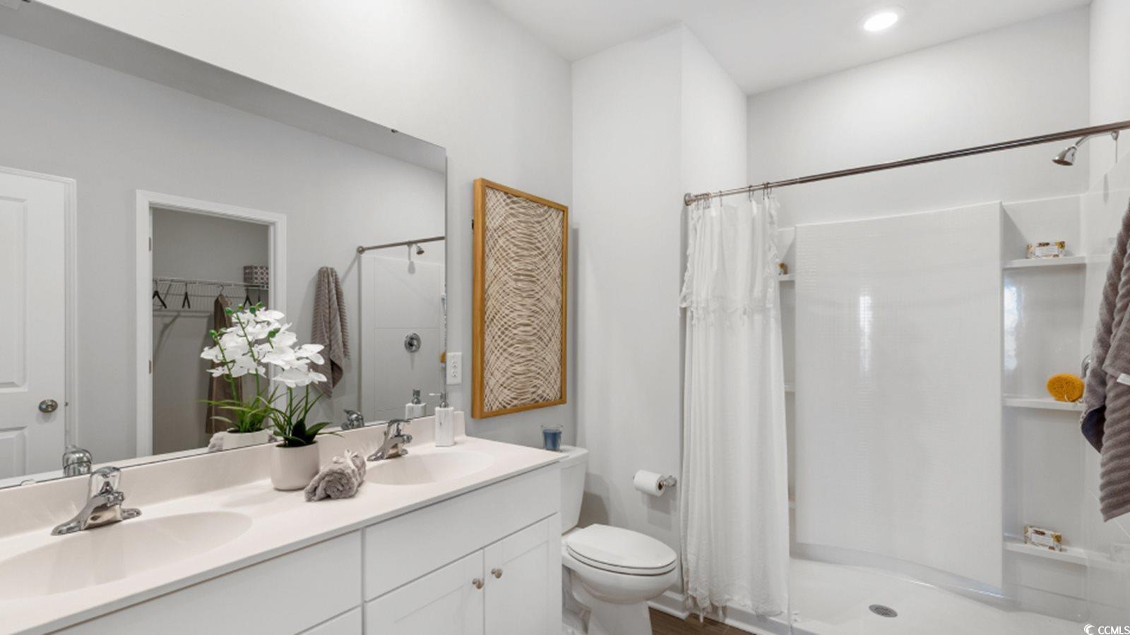 1170 Silver Perch Place Sunset Beach, NC 28468 - Photo 11 of 13 Full bathroom with a stall shower, toilet, and dou