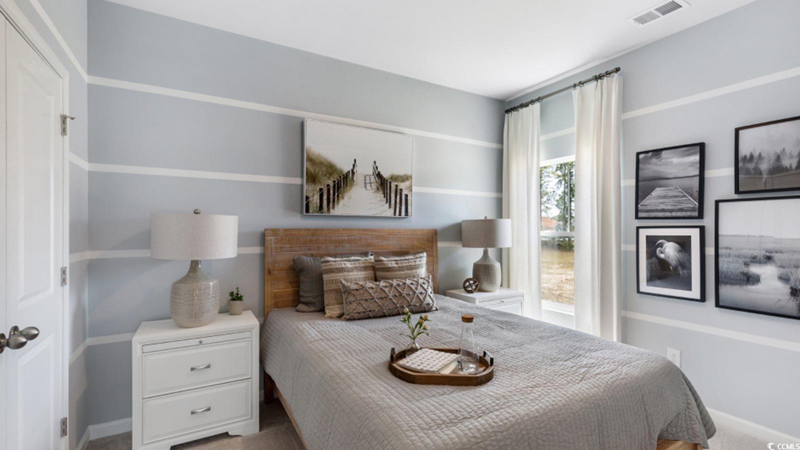 1170 Silver Perch Place Sunset Beach, NC 28468 - Photo 13 of 13 Carpeted bedroom with baseboards