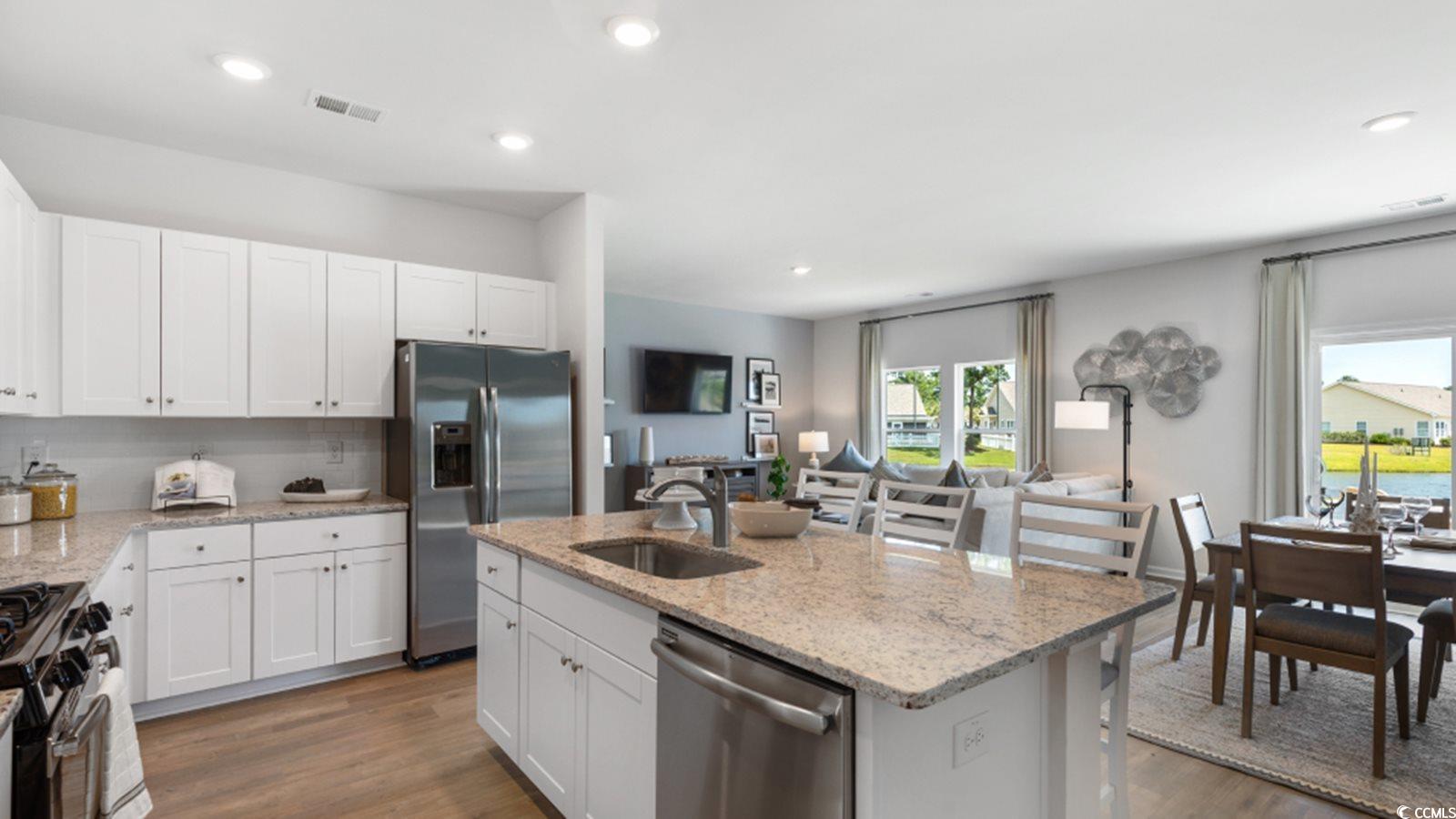 1170 Silver Perch Place Sunset Beach, NC 28468 - Photo 4 of 13 Kitchen featuring stainless steel appliances, a si