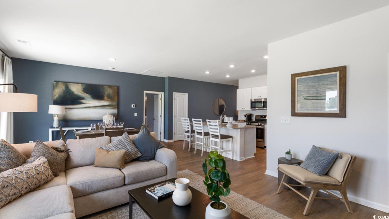 1170 Silver Perch Place Sunset Beach, NC 28468 - Photo 6 of 13 Living room with wood finished floors, recessed li
