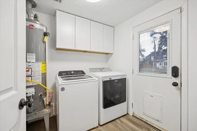 a view of a yard with plants and table