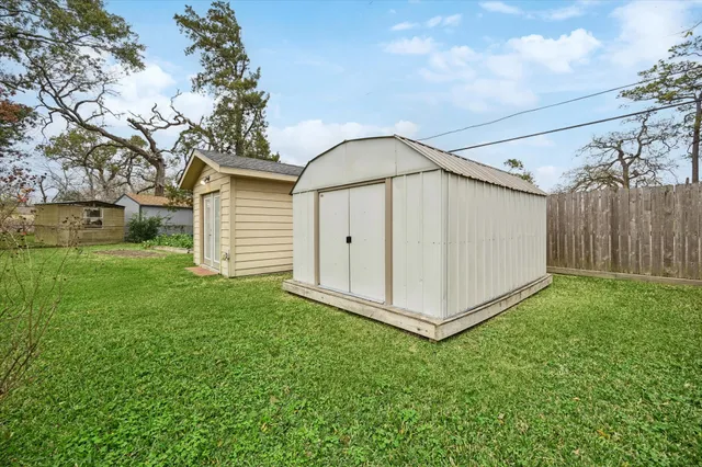 a front view of a house with a garden and porch