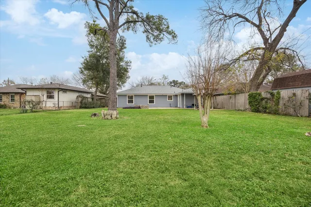 a front view of a house with a garden and porch