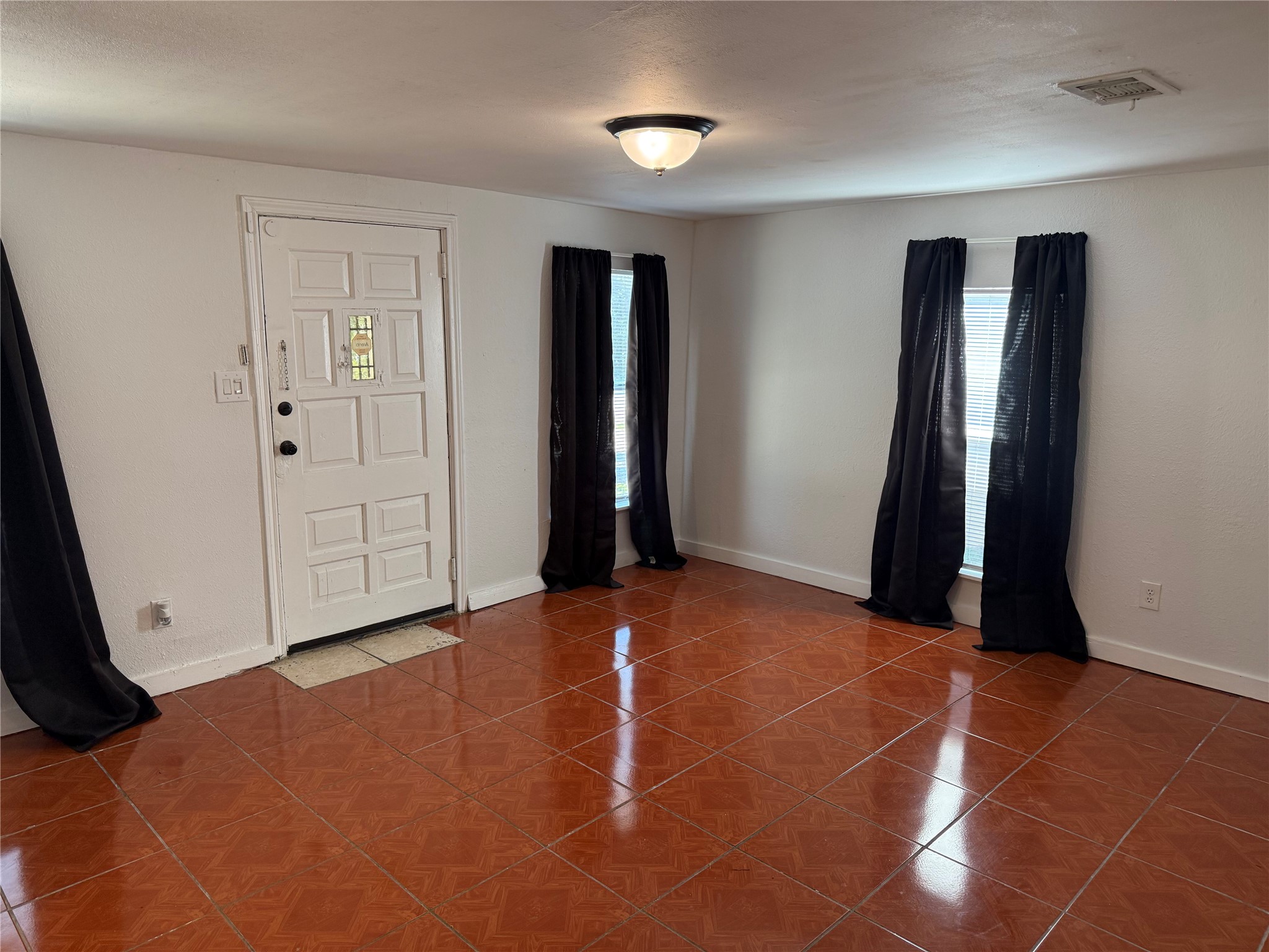 909 East Market Street Lockhart, TX 78644 - Photo 3 of 19 a view of empty room with ceiling fan
