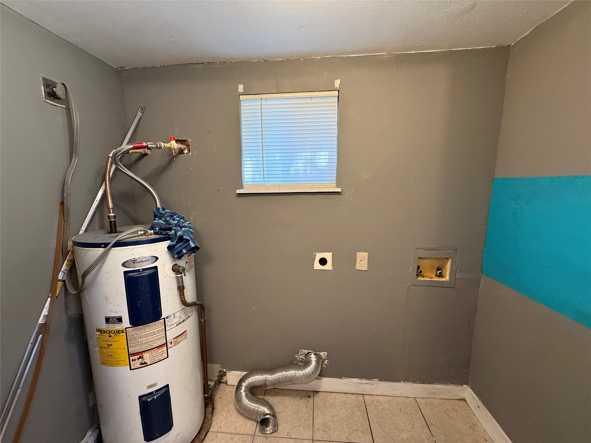 909 East Market Street Lockhart, TX 78644 - Photo 7 of 19 a bathroom with a sink and a mirror