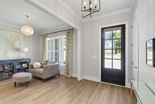 a bedroom with furniture and wooden floor