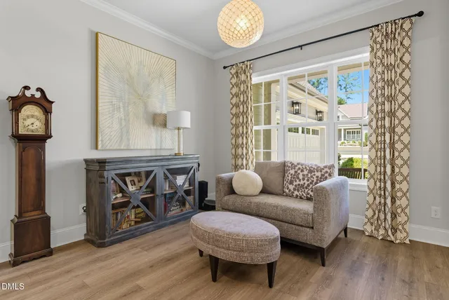 a living room with furniture fireplace and flat screen tv