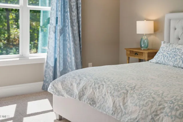 a bathroom with bathtub and window