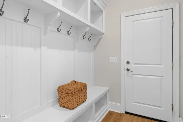 front view of a building with wooden stairs and furniture