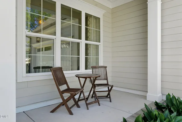 a view of a chair and table on the balcony