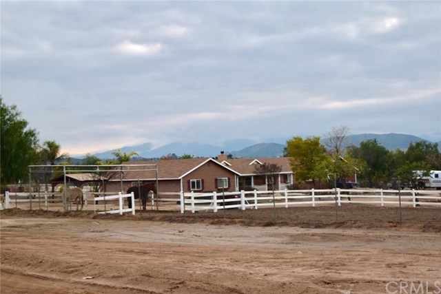 a view of houses with trees in the background