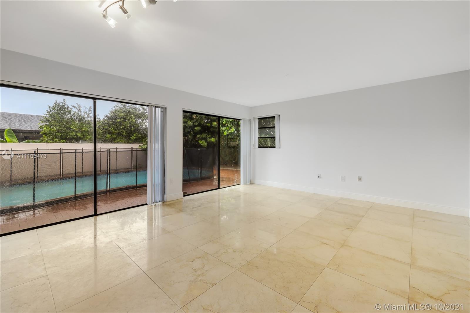 330 Southwest 133rd Place Miami, FL 33184 - Photo 17 of 51 a view of an empty room with glass windows