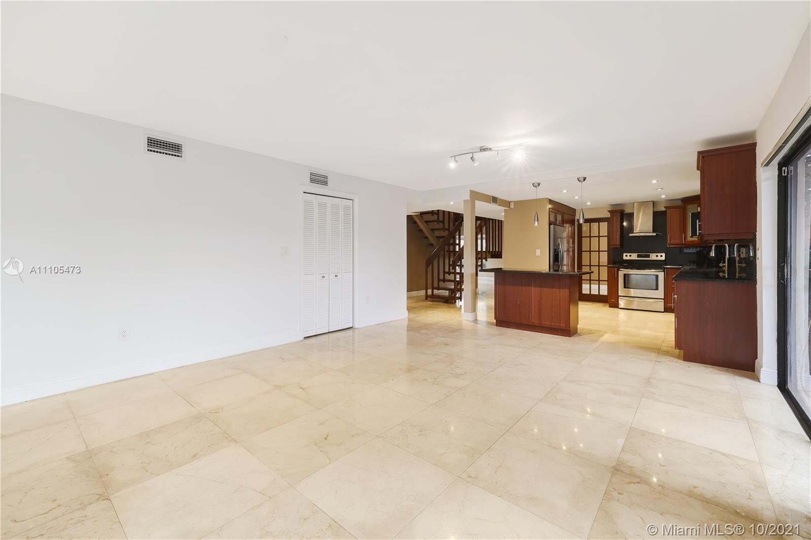 330 Southwest 133rd Place Miami, FL 33184 - Photo 20 of 51 a view of a kitchen with a refrigerator and a stove top oven