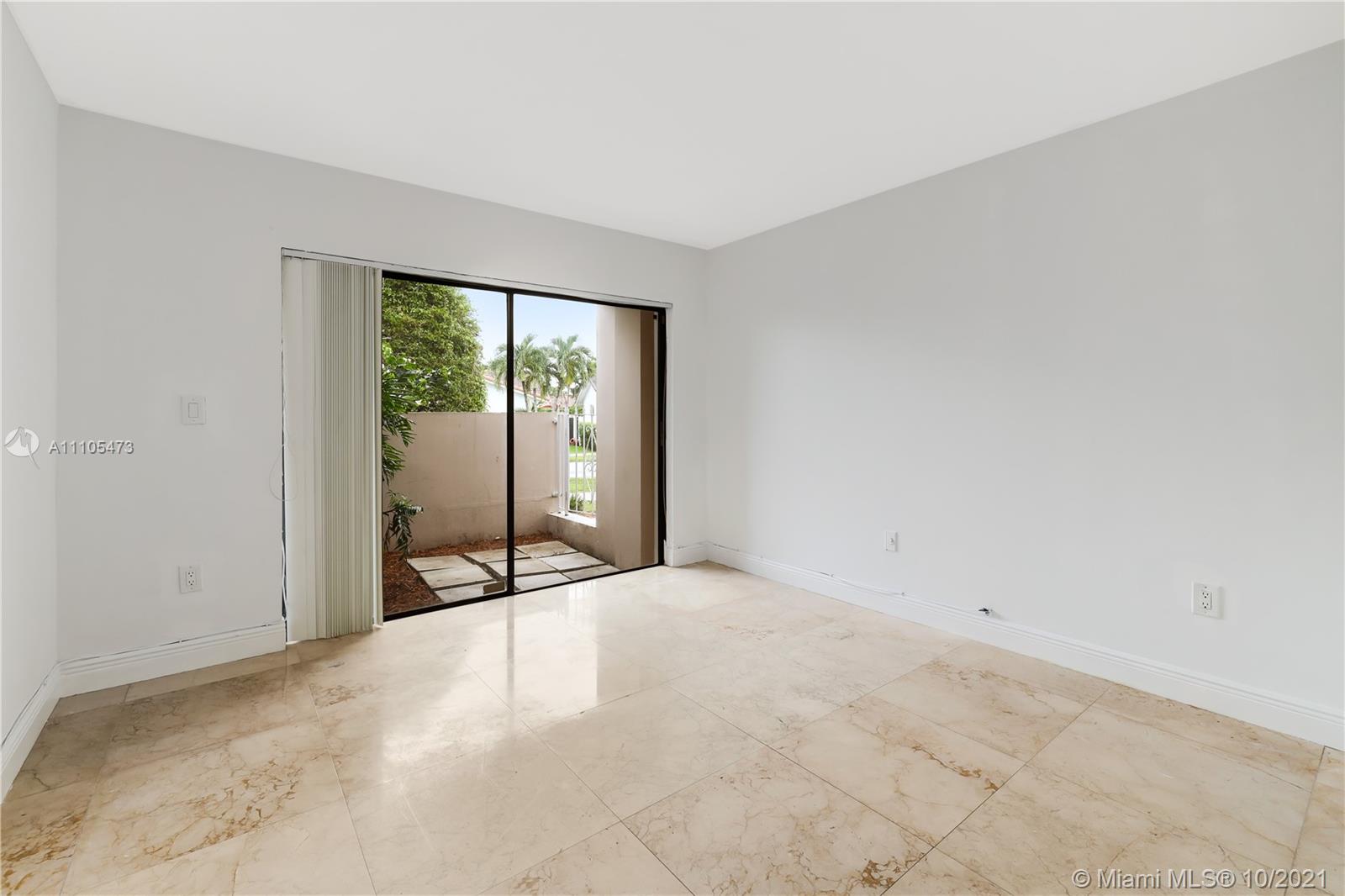 330 Southwest 133rd Place Miami, FL 33184 - Photo 22 of 51 an empty room with sliding glass door and shower