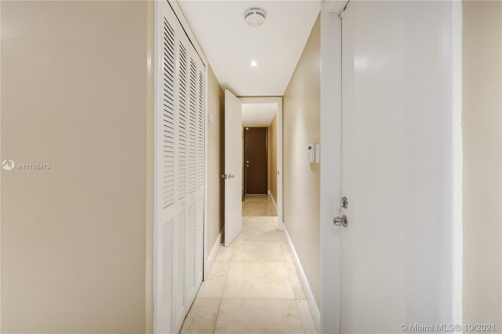 330 Southwest 133rd Place Miami, FL 33184 - Photo 24 of 51 a view of a hallway with wooden shelves