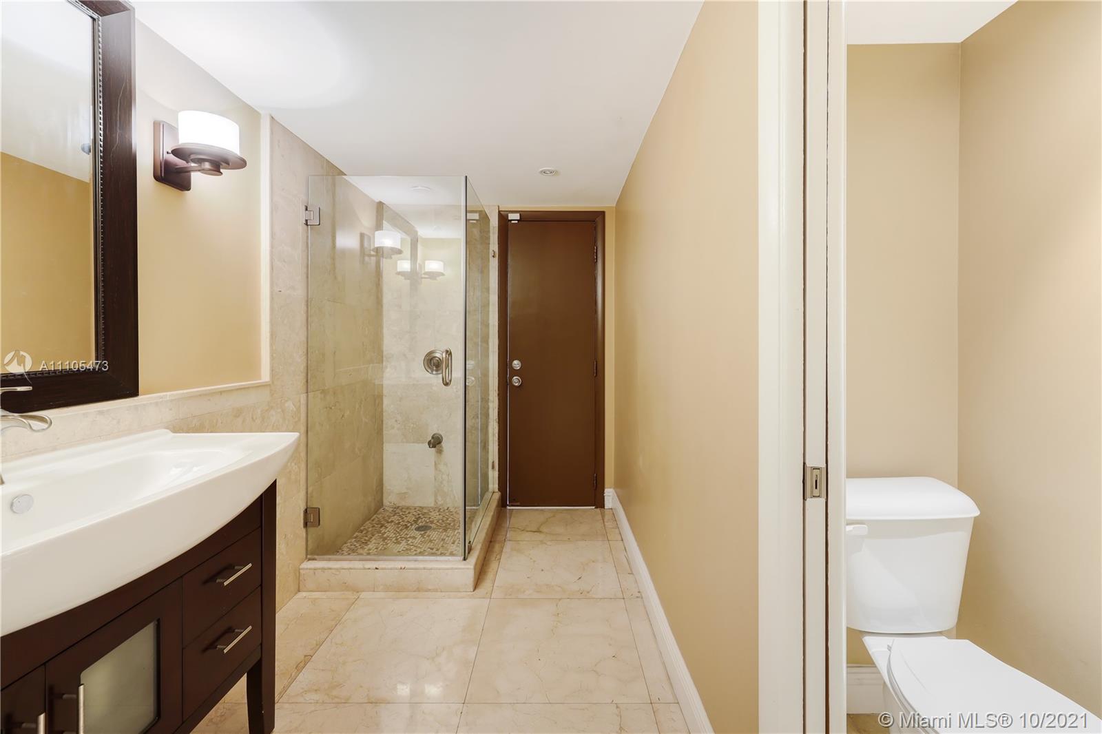 330 Southwest 133rd Place Miami, FL 33184 - Photo 25 of 51 a bathroom with a sink and a mirror