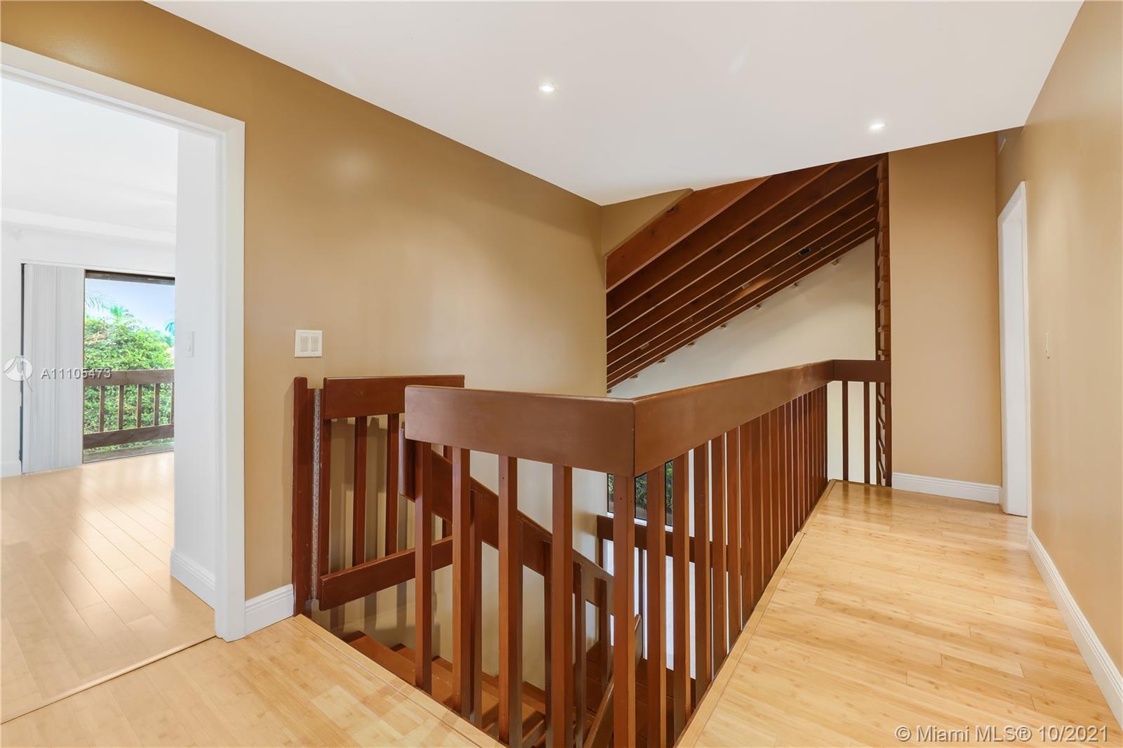 330 Southwest 133rd Place Miami, FL 33184 - Photo 26 of 51 a view of a hallway with wooden floor and windows