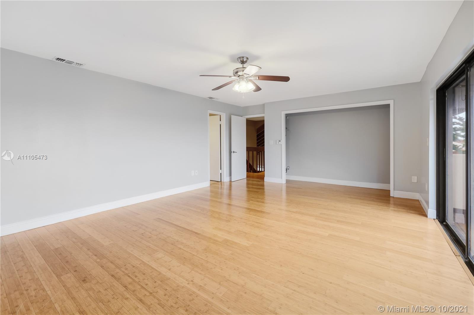 330 Southwest 133rd Place Miami, FL 33184 - Photo 28 of 51 a view of an empty room with chandelier fan and window