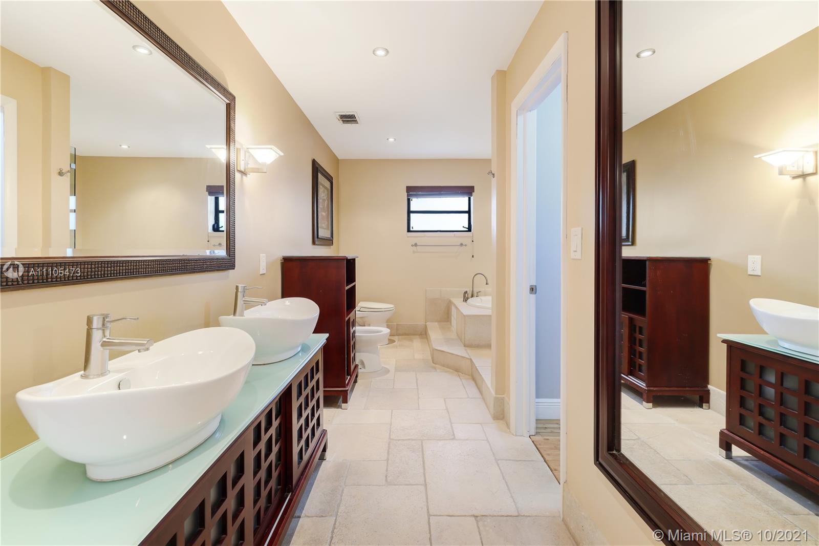 330 Southwest 133rd Place Miami, FL 33184 - Photo 31 of 51 a bathroom with a sink and mirror