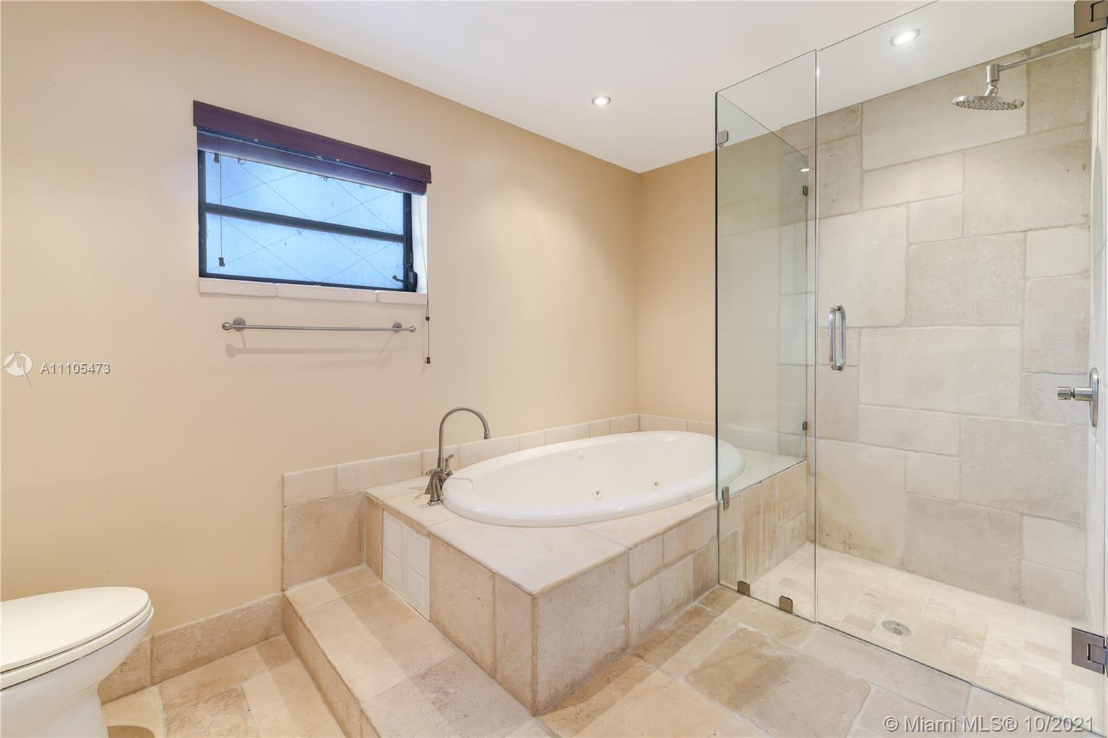 330 Southwest 133rd Place Miami, FL 33184 - Photo 32 of 51 a bathroom with a sink a toilet and shower