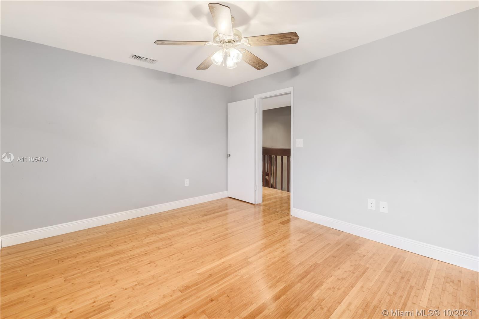 330 Southwest 133rd Place Miami, FL 33184 - Photo 38 of 51 wooden floor in an empty room
