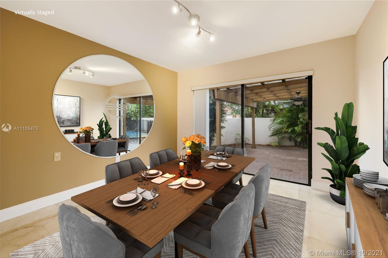 330 Southwest 133rd Place Miami, FL 33184 - Photo 4 of 51 a view of a dining room with furniture and a potted plant