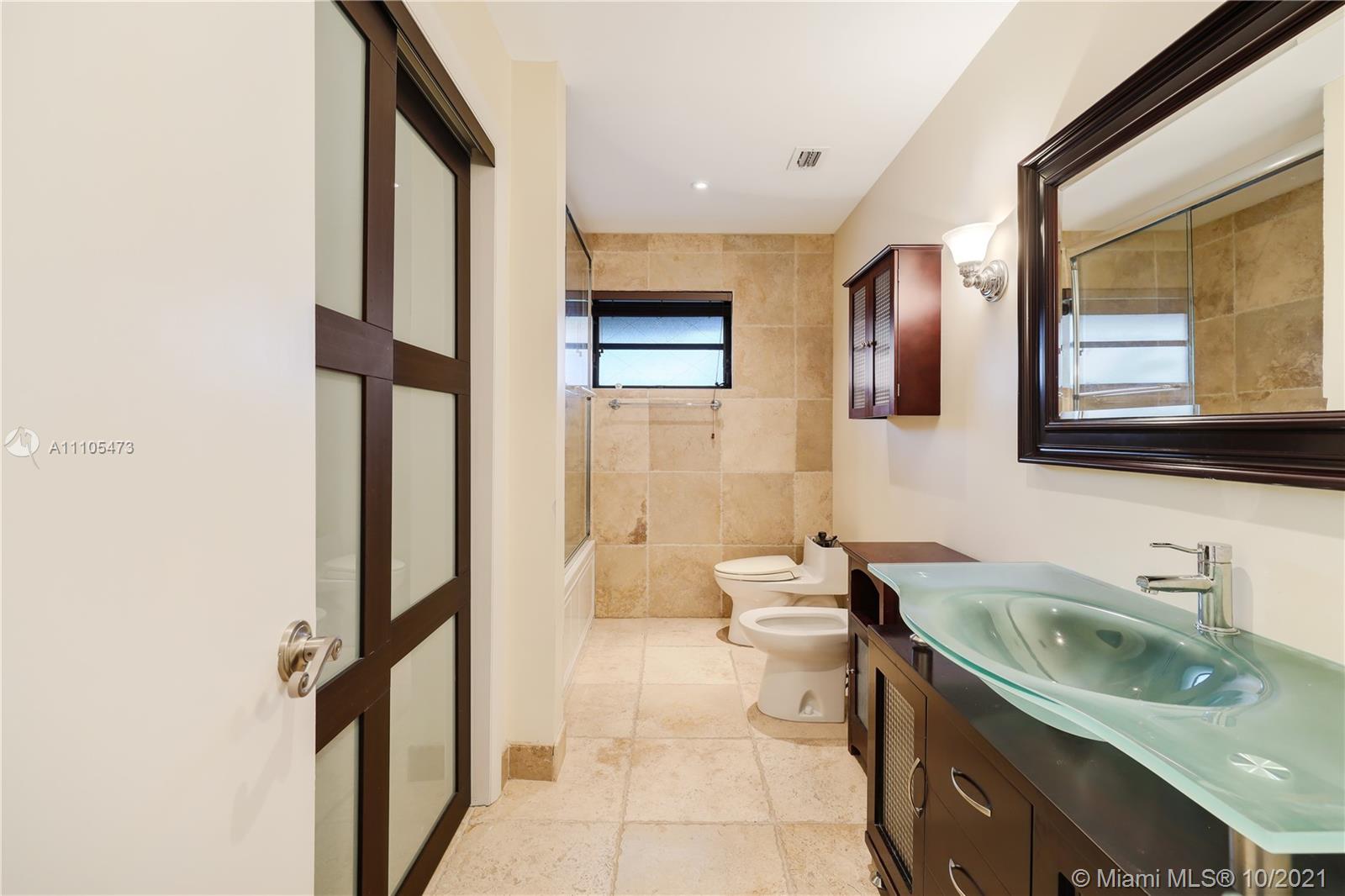 330 Southwest 133rd Place Miami, FL 33184 - Photo 41 of 51 a bathroom with a sink a toilet and shower