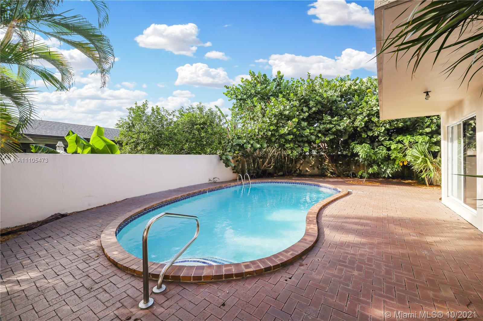330 Southwest 133rd Place Miami, FL 33184 - Photo 46 of 51 a view of a swimming pool with an outdoor seating
