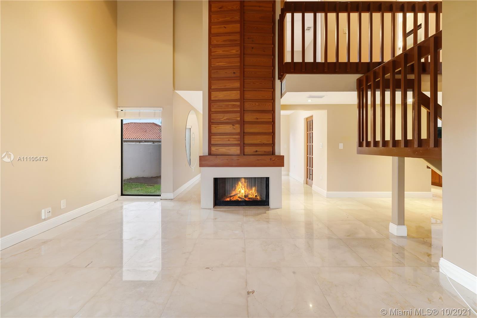 330 Southwest 133rd Place Miami, FL 33184 - Photo 7 of 51 a view of a hallway with a fireplace