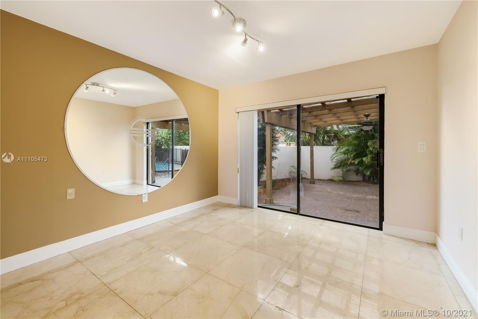 330 Southwest 133rd Place Miami, FL 33184 - Photo 10 of 51 an empty room with a large window and mirror
