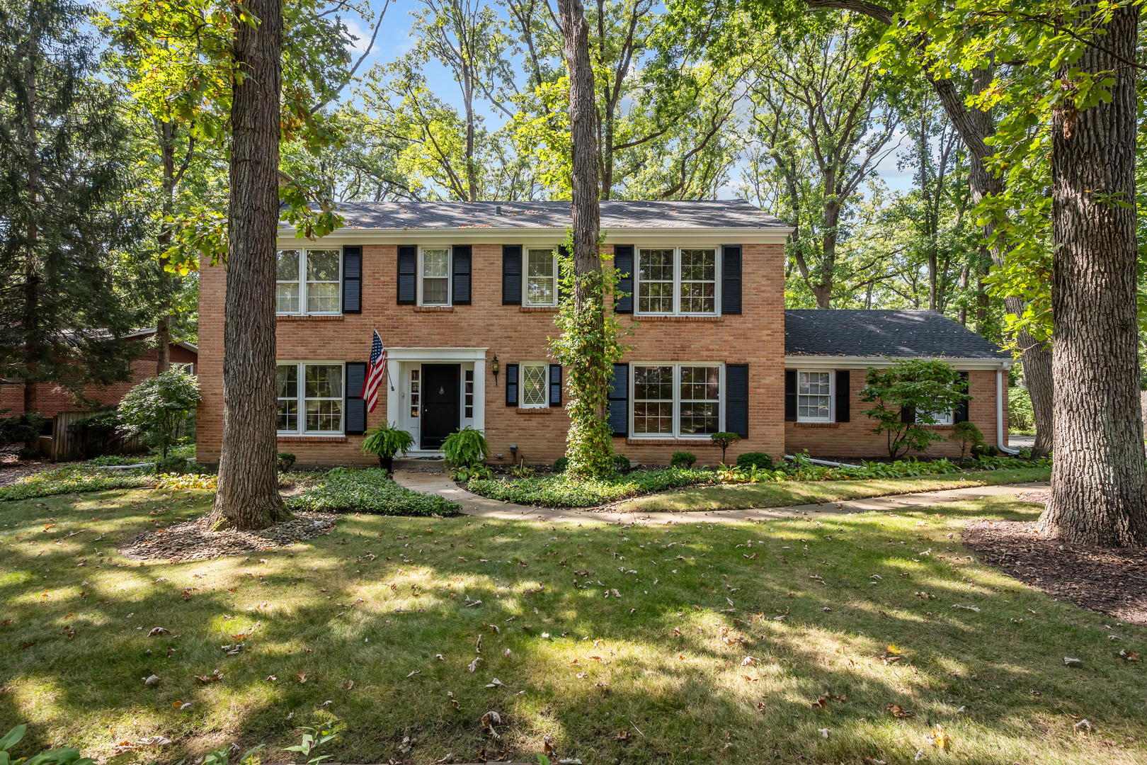 1010 South Green Bay Road Lake Forest, IL 60045 - Photo 1 of 25 a view of a yard in front of a house with large tree