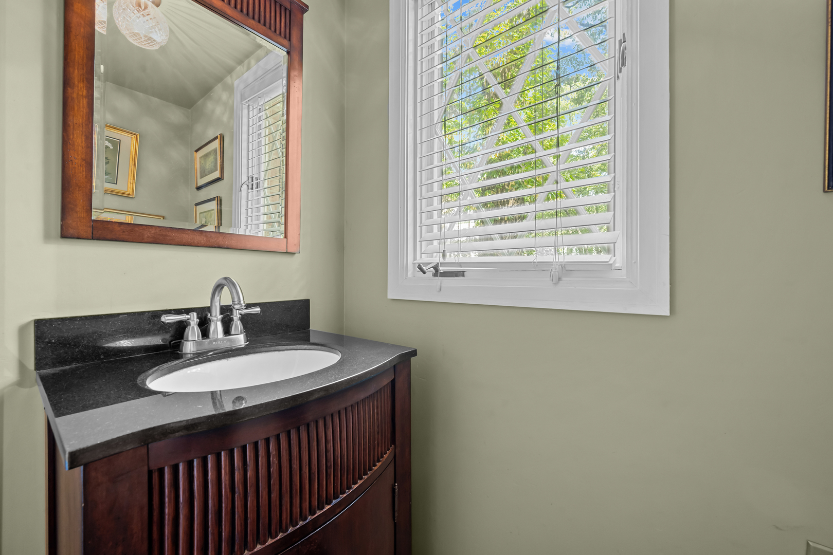 1010 South Green Bay Road Lake Forest, IL 60045 - Photo 11 of 25 a bathroom with a sink and a mirror